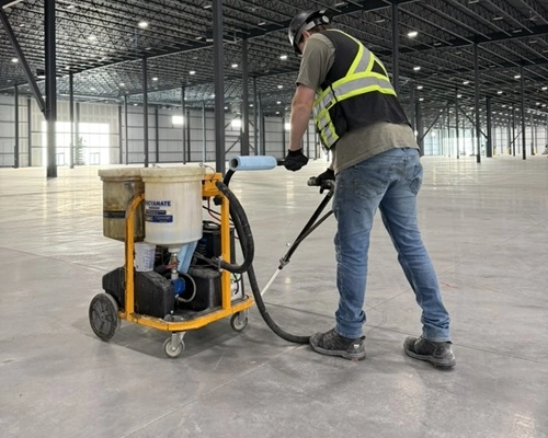Hardscapes employee working on industrial jobsite